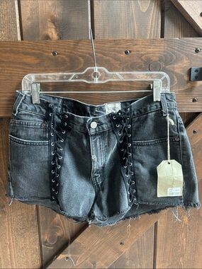 Worn Black Lace-Up Denim Shorts with Frayed Hem
